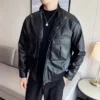 Model wearing a black men's leather motorcycle jacket with a classic and timeless look.