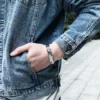 Man wearing stainless steel bracelet with magnetic stones