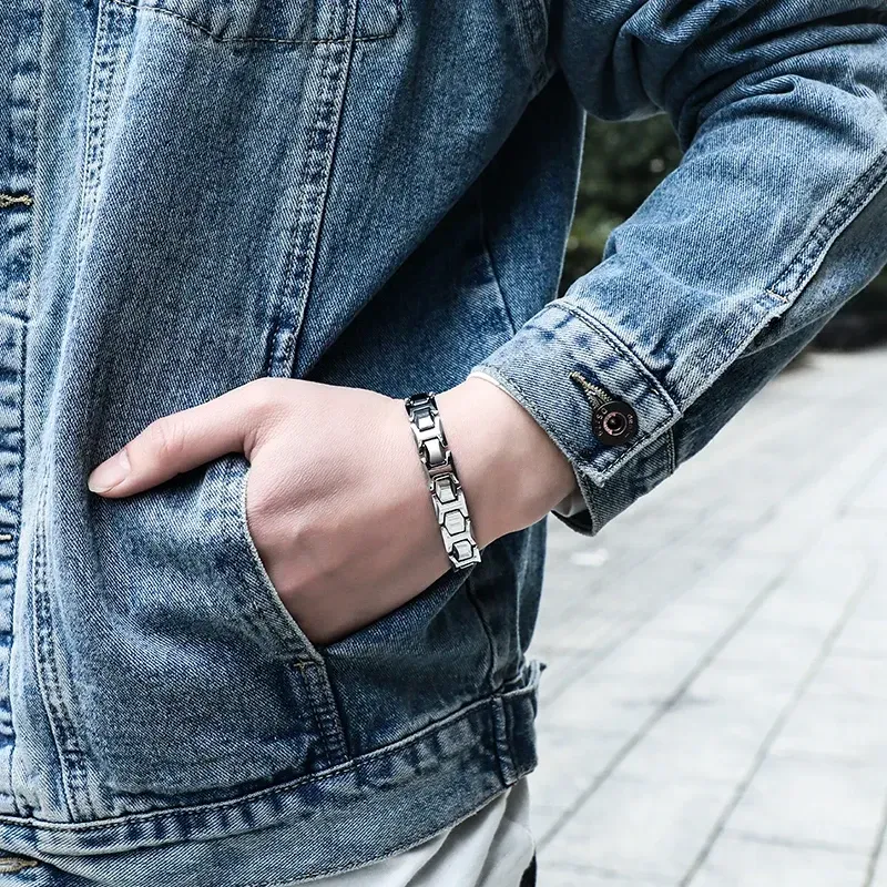 Man wearing stainless steel bracelet with magnetic stones