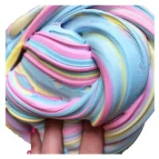 Fluffy Light Slime - Soft, cloud-like slime being shaped into a small sculpture by a child