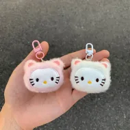 Two adorable Hello Kitty Plush Keychains held in hand, showcasing their soft and fluffy designs in pink and white.